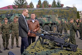 RZESZOW, POLAND - MARCH 22: Prince William, The Prince of Wales viewing military hardware with Polish Deputy Prime Minister and Minister of National Defence, Mariusz Blaszczak, during a visit to the 3rd Brigade Territorial Defense Force base that has been heavily involved in providing support to Ukraine on March 22, 2023 in Warsaw, Poland.  Prince William is meeting with the Polish Defense Minister, Mariusz Blaszczak, and speaking to Polish and British troops to learn about the strong companionship they have formed since working together to support Ukraine.  (Photo by Yui Mok - Pool/Getty Images)