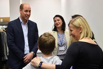 epa10537490 Britain's Prince William, the Prince of Wales chats with children during his visit to  refugees reception center for Ukrainians in Mokotow district in Warsaw, Poland, 22 March 2023. Britain's Prince William is paying a surprise visit to Poland during which he met with Polish and British soldiers in Rzeszow and visited a refugee center for Ukrainians.  EPA/RADEK PIETRUSZKA POLAND OUT
