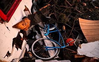 Debris cover a bicycle next to a damaged house in Rolling Fork, Mississippi, on March 25, 2023, after a tornado touched down in the area. - At least 25 people were killed by devastating tornadoes that ripped across the southern US state of Mississippi, tearing off roofs, smashing cars and flattening entire neighborhoods, with the region readying for more severe weather Sunday.
The powerful weather system, accompanied by thunderstorms and driving rain, cut a path of more than 100 miles (60 kilometers) across the state late March 24, 2023, slamming several towns along the way. (Photo by CHANDAN KHANNA / AFP) (Photo by CHANDAN KHANNA/AFP via Getty Images)