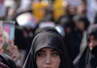 An Iranian woman who is a supporter of Irans Supreme Leader Ayatollah Ali Khamenei takes part a pro-government rally against Irans anti government unrests, after Tehrans Friday prayers, September 23, 2022.  (Photo by Morteza Nikoubazl/NurPhoto via Getty Images)