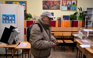 epa10554841 A man votes at a polling station during parliamentary elections in Sofia, Bulgaria, 02 April 2023. Bulgaria is holding its fifth parliamentary elections in two years.  EPA/VASSIL DONEV