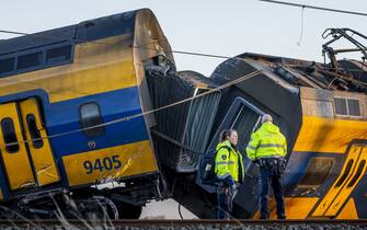 Voorschoten - Emergency services at work at a derailed night train.  The passenger train collided with construction equipment on the track.  One person died and several people were seriously injured.  A freight train was also involved in the accident.  ANP REMKO DE WAAL netherlands out - belgium out(Photo by Remko de Waal/ANP/Sipa USA)