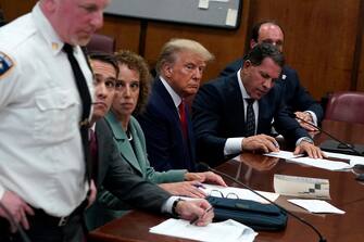 epa10558826 Former US President Donald J. Trump (C) sits in the courtroom for his arraignment in New York Criminal Court in New York, New York, USA, 04 April 2023. A Manhattan grand jury voted to indict former President Donald J. Trump last week.  EPA/TIMOTHY A. CLARY