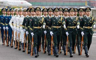 Members of the Chinese guard of honor arrive for the welcome ceremony of French President Emmanuel Macron at Beijing Capital International Airport in Beijing on April 5, 2023. (Photo by Ludovic MARIN / AFP) (Photo by LUDOVIC MARIN/AFP via Getty Images)