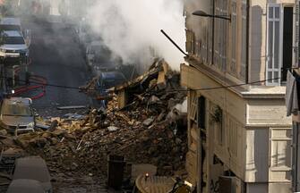 This photograph shows rubbles where a building collapsed in Marseille, southern France, on April 9, 2023. - 
