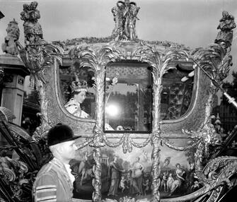 Embargoed to 2230 Sunday April 9 File photo dated 2/6/1953 of Queen Elizabeth II smiling in the Gold State Coach leaving Westminster Abbey for Buckingham Palace after the Coronation.  The King and Queen Consort will travel to the coronation in the modern Diamond Jubilee State Coach and return in the historic Gold State Coach.  Issue date: Sunday April 9, 2023.
