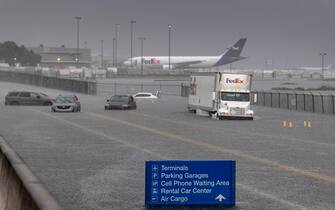 epa10571675 Several cars are stuck in flood water on Fort Lauderdale International Airport's West Perimeter road in Fort Lauderdale, Florida, USA, 13 April 2023. Heavy rains in the past days produced flooding in the lower areas of the Miami-Dade and Broward counties.  EPA/CRISTOBAL HERRERA-ULASHKEVICH