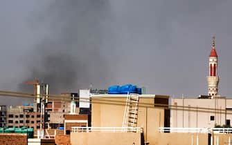 Smoke billows over residential buildings in eastern Khartoum on April 22, 2023, during ongoing battles between the forces of two rival generals. - Fighting in Sudan's capital entered a second week today as crackling gunfire shattered a temporary truce, the latest battles between forces of rival generals that have already left hundreds dead and thousands wounded. (Photo by AFP) (Photo by -/AFP via Getty Images)
