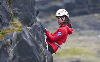 MERTHYR TYDFIL, WALES - APRIL 27: Catherine, Princess of Wales abseils down a quarry at the Central Beacons Mountain Rescue during day one of her visit to Wales with Prince William, Prince of Wales on April 27, 2023 in Merthyr Tydfil, Wales. The Prince and Princess of Wales are visiting the country to celebrate the 60th anniversary of Central Beacons Mountain Rescue and to meet members of local communities. (Photo by Matthew Horwood - WPA Pool/Getty Images)