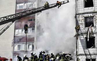 epaselect epa10595916 Rescuers work at the site of a damaged residential building after a missile attack, in Uman, Cherkasy region, central Ukraine, 28 April 2023, amid Russia's invasion. At least six people were killed as a result of a rocket attack in Uman, and nine others injured, the Head of the Cherkasy Regional Military Administration, Ihor Taburets wrote on telegram. Ukraine's Ministry of Internal Affairs said on 28 April, that the Russian army conducted attacks on residential buildings across the country, including Dnipro, Uman and Ukrainka in the Kyiv region. Russian troops entered Ukrainian territory in February 2022, starting a conflict that has provoked destruction and a humanitarian crisis.  EPA/OLEG PETRASYUK