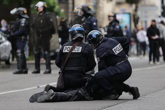 French riot police detain a protester during clashes on a May Day (Labour Day) demonstration, to mark the international day of the workers, more than a month after the government pushed an unpopular pensions reform act through parliament, in Bordeaux, southwestern France, on May 1, 2023. - Opposition parties and trade unions have urged protesters to maintain their three-month campaign against the law that will hike the retirement age to 64 from 62. (Photo by Thibaud MORITZ / AFP) (Photo by THIBAUD MORITZ/AFP via Getty Images)