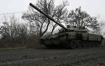 A Ukrainian tank rolls on a muddy road near Bakhmut, Donetsk region, on March 29, 2023, amid the Russian invasion of Ukraine.  (Photo by Genya SAVILOV/AFP) (Photo by GENYA SAVILOV/AFP via Getty Images)