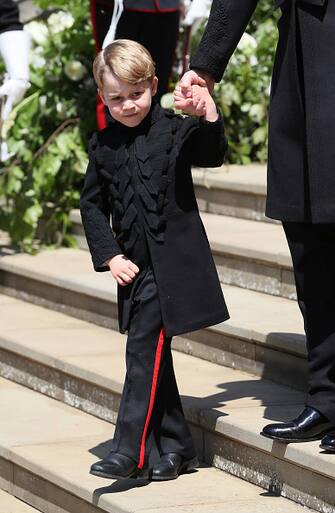 Britain's Prince George walks down the west steps after attending the wedding ceremony of Britain's Prince Harry, Duke of Sussex and US actress Meghan Markle at St George's Chapel, Windsor Castle, in Windsor, on May 19, 2018. (Photo by Brian Lawless / POOL / AFP) (Photo credit should read BRIAN LAWLESS/AFP via Getty Images)