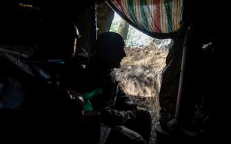 DONETSK REGION, UKRAINE - 2023/05/07: A soldier of the Ukrainian Armed Forces in a dugout at a firing position in the suburbs of Bakhmut town.  (Photo by Mykhaylo Palinchak/SOPA Images/LightRocket via Getty Images)