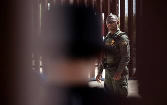 epa10620076 A Border Patrol officer works along the border of Mexico and the United States, in Yuma, Arizona, USA, 10 May 2023. A significant increase in the number of migrant crossings is expected as the COVID-era Title 42 policy, which allowed for a quick expulsion of illegal immigrants, is set to expire on 11 May.  EPA/ETIENNE LAURENT