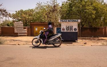 A woman rides a motorcycle in Ouagadougou, on March 2, 2023. (Photo by OLYMPIA DE MAISMONT / AFP) (Photo by OLYMPIA DE MAISMONT/AFP via Getty Images)
