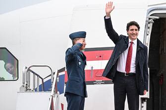 Canada's Prime Minister Justin Trudeau (R) arrives at Hiroshima airport in Mihara, Hiroshima prefecture on May 18, 2023, to attend the G7 Leaders' Summit. (Photo by Yuichi YAMAZAKI / AFP) (Photo by YUICHI YAMAZAKI/AFP via Getty Images)