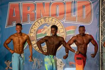 epa10638606 Athletes compete in the Men's Physique section of the Arnold Classic Africa multi-sport festival, held in Johannesburg, South Africa, 19 May 2023. The festival sees athletes competing in 45 different sports and events.  Initiated by former Austrian body builder Arnold Schwarzenegger, the sports festival does not only present body building shows but also classes and competitions in categories from Arm-Wrestling to Zumba.  EPA/KIM LUDBROOK