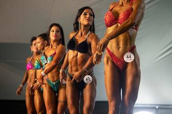 epa10638644 Athletes compete in the Women's Physique section of the Arnold Classic Africa multi-sport festival, held in Johannesburg, South Africa, 19 May 2023. The festival sees athletes competing in 45 different sports and events.  Initiated by former Austrian body builder Arnold Schwarzenegger, the sports festival does not only present body building shows but also classes and competitions in categories from Arm-Wrestling to Zumba.  EPA/KIM LUDBROOK