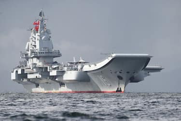 China's sole aircraft carrier, the Liaoning, arrives in Hong Kong waters on July 7, 2017, less than a week after a high-profile visit by president Xi Jinping. - China's national defence ministry had said the Liaoning, named after a northeastern Chinese province, was part of a flotilla on a "routine training mission" and would make a port of call in the former British colony. (Photo by Anthony WALLACE / AFP) (Photo by ANTHONY WALLACE/AFP via Getty Images)