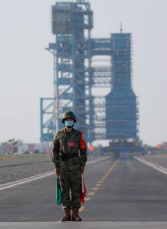 epa10662680 A soldier stands guard before the launch of the Long March-2F carrier rocket with a Shenzhou-16 manned space flight at the Jiuquan Satellite Launch Centre, in Jiuquan, Gansu province, China, 30 May 2023. The Shenzhou-16 manned space flight mission will transport three Chinese astronauts to the Tiangong space station.  EPA/ALEX PLAVEVSKI
