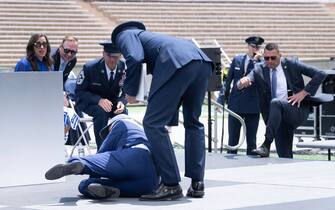 US President Joe Biden falls during the graduation ceremony at the United States Air Force Academy, just north of Colorado Springs in El Paso County, Colorado, on June 1, 2023. (Photo by Brendan Smialowski / AFP) (Photo by BRENDAN SMIALOWSKI/AFP via Getty Images)