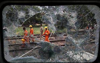 epa10670003 The National Disaster Response Force Rescue continues work at the site of a train accident at Odisha Balasore, India, 03 June 2023. Over 200 people died and more than 900 were injured after three trains collided one after another. According to railway officials the Coromandel Express, which operates between Kolkata and Chennai, crashed into the Howrah Superfast Express.  EPA/PIYAL ADHIKARY
