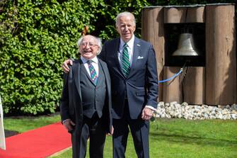 epa10571071 Irish President Michael D. Higgins (L) and US President Joe Biden after ringing the Peace Bell at Aras an Uachtarain (Residence of the President of Ireland) in Phoenix Park in Dublin, Ireland, 13 April 2023. This is the second day of a four-day visit by Biden to Northern Ireland and the Republic of Ireland to mark the 25th anniversary of the Good Friday Agreement.  EPA/JULIEN BEHAL / POOL