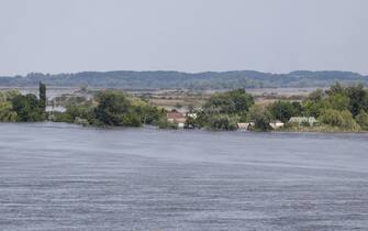 This general view shows a partially flooded area of Kherson on June 6, 2023, following damage sustained at Kakhovka HPP dam. The partial destruction on June 6, of a major Russian-held dam in southern Ukraine unleashed a torrent of water that sent people fleeing flooding on the war's front line. Moscow and Kyiv traded blame for ripping a gaping hole in the Kakhovka dam as expectations built over the start of Ukraine's long-awaited offensive. (Photo by STRINGER / AFP)