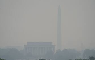 Jun 8, 2023;  Arlington, VA, USA;  Smoke and haze caused by the wildfires in Canada is seen over Washington, DC from Arlington, VA.  Authorities warned residents across much of the Northeast to stay inside and limit or avoid outdoor activities Thursday, extending “Code Red” alerts in some places for a third-straight day.. Mandatory Credit: Megan Smith-USA TODAY/Sipa USA