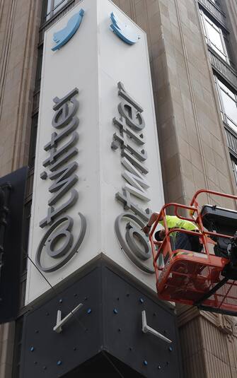 epa10766834 A worker removes letters from the iconic vertical Twitter sign at the company’s headquarters after Twitter owner Elon Musk annouced the rebranding of the social media platorm to X in San Francisco, California, USA, 24 July 2023. Work was halted due to San Francisco police responding to a call from building security that the signs were being stolen. A San Francisco police spokesperson stated that Twitter had a work order to take the sign down but didn’t communicate that to security and the property owner of the building.  EPA/JOHN G. MABANGLO