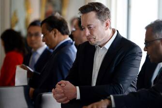 epa10629641 SpaceX, Twitter and electric car maker Tesla CEO Elon Musk (C) looks on among other CEOs before a roundtable during the 6th edition of the 'Choose France' Summit, at the Chateau de Versailles, outside Paris, France, 15 May 2023. Since 2018, the Choose France Summit seeks to promote FranceÂ?s economic attractiveness and encourage international investment across the country and brings together hundreds of leaders from the largest multinational corporations.  EPA/LUDOVIC MARIN / POOL  MAXPPP OUT