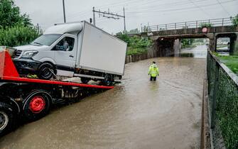 A goods transport is helped out of the floodwater at Lorenskog station on August 7, 2023, as storm Hans has been categorized as red weather warning in south-east Norway.  (Photo by Stian Lysberg Solum / NTB / AFP) / Norway OUT (Photo by STIAN LYSBERG SOLUM/NTB/AFP via Getty Images)