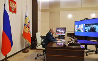 Russian President Vladimir Putin listens to the report of Russian Defence Minister Sergei Shoigu and Commander of the Admiral Gorshkov frigate Igor Krokhmal before a ceremony to launch the Admiral Gorshkov frigate to the combat mission, via a video conference in Moscow, Russia, on January 4, 2023. (Photo by Mikhail KLIMENTYEV / Sputnik / AFP) (Photo by MIKHAIL KLIMENTYEV/Sputnik/AFP via Getty Images)