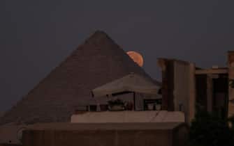 GIZA, EGYPT - AUGUST 31: A view of Super Moon known as 'Blue Moon' behind the Pyramids of Giza in Egypt on August 31, 2023. (Photo by Mohamed Elshahed/Anadolu Agency via Getty Images)