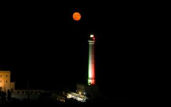 Drone view of the supermoon, also known as a Sturgeon moon rise over the lighthouse of Santa Maria di Leuca, Italy, on August 2, 2023. (Photo by Manuel Romano/NurPhoto via Getty Images)