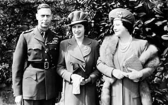 Queen Elizabeth (later the Queen Mother) and King George VI with their daughter Princess Elizabeth (later Queen Elizabeth II), who will shortly celebrate her 18th birthday.