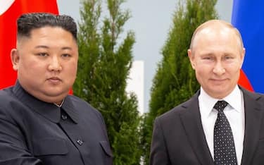 Russian President Vladimir Putin and North Korean leader Kim Jong Un shake hands as they pose for pictures prior to their talks at the Far Eastern Federal University campus on Russky island in the far-eastern Russian port of Vladivostok on April 25, 2019. (Photo by Alexander Zemlianichenko / POOL / AFP) (Photo by ALEXANDER ZEMLIANICHENKO/POOL/AFP via Getty Images)
