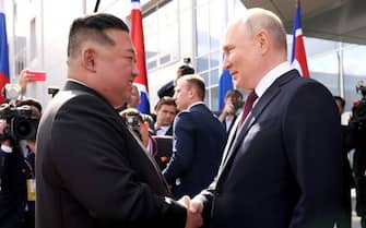 AMUR REGION, RUSSIA - SEPTEMBER 13: (----EDITORIAL USE ONLY - MANDATORY CREDIT - 'KREMLIN PRESS OFFICE / HANDOUT' - NO MARKETING NO ADVERTISING CAMPAIGNS - DISTRIBUTED AS A SERVICE TO CLIENTS----) Russian President Vladimir Putin (R) shakes hand with North Korean leader Kim Jong-Un (L) ahead of the their inspect the Russian spaceport Vostochny Cosmodrome in Russia's Amur region in the Far East on September 13, 2023. North Korean leader Kim Jong-Un said on Wednesday that relations with Russia are 'the very first priority' for his country. Putin and Kim then visited several facilities of the cosmodrome and also examined the construction of the new infrastructure. (Photo by Kremlin Press Office / Handout/Anadolu Agency via Getty Images)