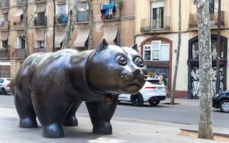 BARCELONA, SPAIN - April 15, 2023: Fernando Botero's 'Cat', a bronze sculpture in downtown Barcelona.