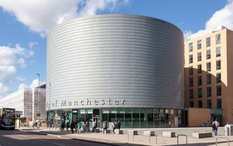 The large, drum-shaped building of The University of Manchester, University Place, Oxford Road, Manchester.