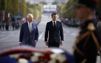 epa10871533 Britain's King Charles III (L) and French president Emmanuel Macron (R) attend a remembrance ceremony at Arc de Triomphe Paris, France, 20 September 2023. The visit, initially planned in March and postponed because of unrest in France, will lead the King and Queen of Great Britain to Paris and Bordeaux and includes a state dinner, official appointments with president Macron and more informal meetings with French and British citizens.  EPA/YOAN VALAT / POOL