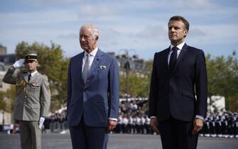 epa10871428 Britain's King Charles III (L) and French president Emmanuel Macron (R) attend a remembrance ceremony at Arc de Triomphe Paris, France, 20 September 2023.The visit, initially planned in March and postponed because of unrest in France, will lead the King and Queen of Great Britain to Paris and Bordeaux and includes a state dinner, official appointments with president Macron and more informal meetings with French and British citizens.  EPA/YOAN VALAT / POOL