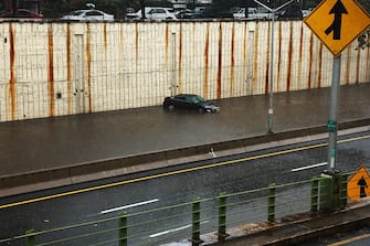 NEW YORK, NEW YORK - SEPTEMBER 29: A vehicle sits submerged after it got stuck in high water on the Prospect Expressway during heavy rain and flooding on September 29, 2023 in the Brooklyn Borough of New York City. Much of the Northeast is experiencing severe flooding after heavy rains swept through the area this morning. (Photo by Spencer Platt/Getty Images)