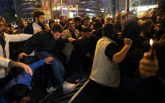 epa10924810 Protesters try to get inside the Israeli Consulate during a rally against an Israeli strike on a hospital in Gaza, in Istanbul, Turkey 17 October 2023 (issued 18 October 2023).  The protest erupted hours after Hamas-led authorities in Gaza said hundreds of people had been killed in an Israeli strike on a hospital in Gaza on 17 October.  According to the Israel Defense Forces (IDF), Islamic Jihad is responsible for a failed rocket launch that hit the hospital.  Earlier in the day, the Palestinian Health Ministry announced that more than 3,000 Palestinians have been killed and over 12,500 others injured since Israel launched retaliatory air strikes in the Gaza Strip.  More than 1,400 Israelis have been killed according to the Israel Defense Forces (IDF) after Hamas militants launched an attack against Israel from the Gaza Strip on 07 October.  Israel has warned all citizens of the Gaza Strip to move to the south ahead of an expected invasion.  EPA/TOLGA BOZOGLU