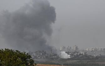 SDEROT, ISRAEL - OCTOBER 29: An incoming Israeli military strike on buildings in Gaza City, as seen from the border area on October 29, 2023 in Sderot, Israel.  In the wake of the Oct. 7 attacks by Hamas that left 1,400 dead and 200 kidnapped, Israel launched a sustained bombardment of the Gaza Strip and threatened a ground invasion to vanquish the militant group that governs the Palestinian territory.  But the fate of the hostages, Israelis and foreign nationals who are being held by Hamas in Gaza, as well as international pressure over the humanitarian situation in Gaza, have complicated Israel's military response to the attacks.  A timeline for a proposed ground invasion remains unclear.  (Photo by Alexi J. Rosenfeld/Getty Images)