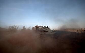 epa10940558 An Israeli Merkava tank during maneuvers at an undisclosed location along the border with Lebanon, in Israel, 26 October 2023. Tensions remain high at the border between Israel and Lebanon after the Israeli-Palestinian conflict escalated following an unprecedented attack carried out by Hamas militants from Gaza into Israel on 07 October 2023. EPA/ATEF SAFADI