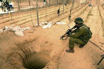 PHILADELPHI CORRIDOR, GAZA - OCTOBER 18: In this photo released by the Israel Defense Forces (IDF), an Israeli army officer inspects a tunnel allegedly used for smuggling weapons October 18, 2006 in the Philadelphi Corridor, Gaza.  Israeli forces entered southern Gaza in an operation to find tunnels used to smuggle weapons from Egypt into Gaza, uncovering five tunnels in a single day.  (Photo by Abir Sultan/IDF via Getty Images)
