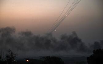 A picture taken from Israel's southern city of Sderot shows rockets fired from Gaza towards Israel on October 28, 2023, amid ongoing battles between Israel and the Palestinian group Hamas. One month after Israel was wracked by Hamas attacks, life has been upended for both the Palestinians and Israel after it launched a war of reprisal in the Gaza Strip. The October 7 attacks by Hamas militants who stormed across from Gaza and struck kibbutzim and southern Israeli areas killed 1,400 people, mostly civilians, and deeply scarred the nation. The health ministry in Hamas-run Gaza says nearly 9,500 have been killed, two-thirds of them women and children, and mostly civilians. (Photo by Aris MESSINIS / AFP)