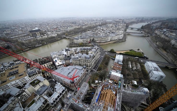 epa11016944 Notre Dame de Paris cathedral (bottom R) is pictured from the top of the spire as restoration work continues in Paris, France, 08 December 2023. French President Emmanuel Macron is visiting Notre Dame Cathedral on 08 December, to mark the one-year countdown to its reopening in 2024 following extensive restoration after the fire four years ago. Macron s visit, continuing his annual tradition since the blaze on 15 April 2019, is aimed to highlight the progress in the works, including the near completion of the cathedral spire.  EPA/CHRISTOPHE ENA / POOL MAXPPP OUT